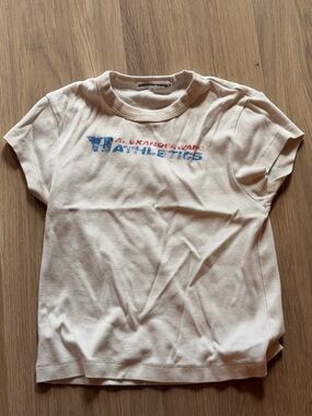 Alexander Wang Athletics Graphic Tee in Off-White with Blue & Red Logo
Size xs
